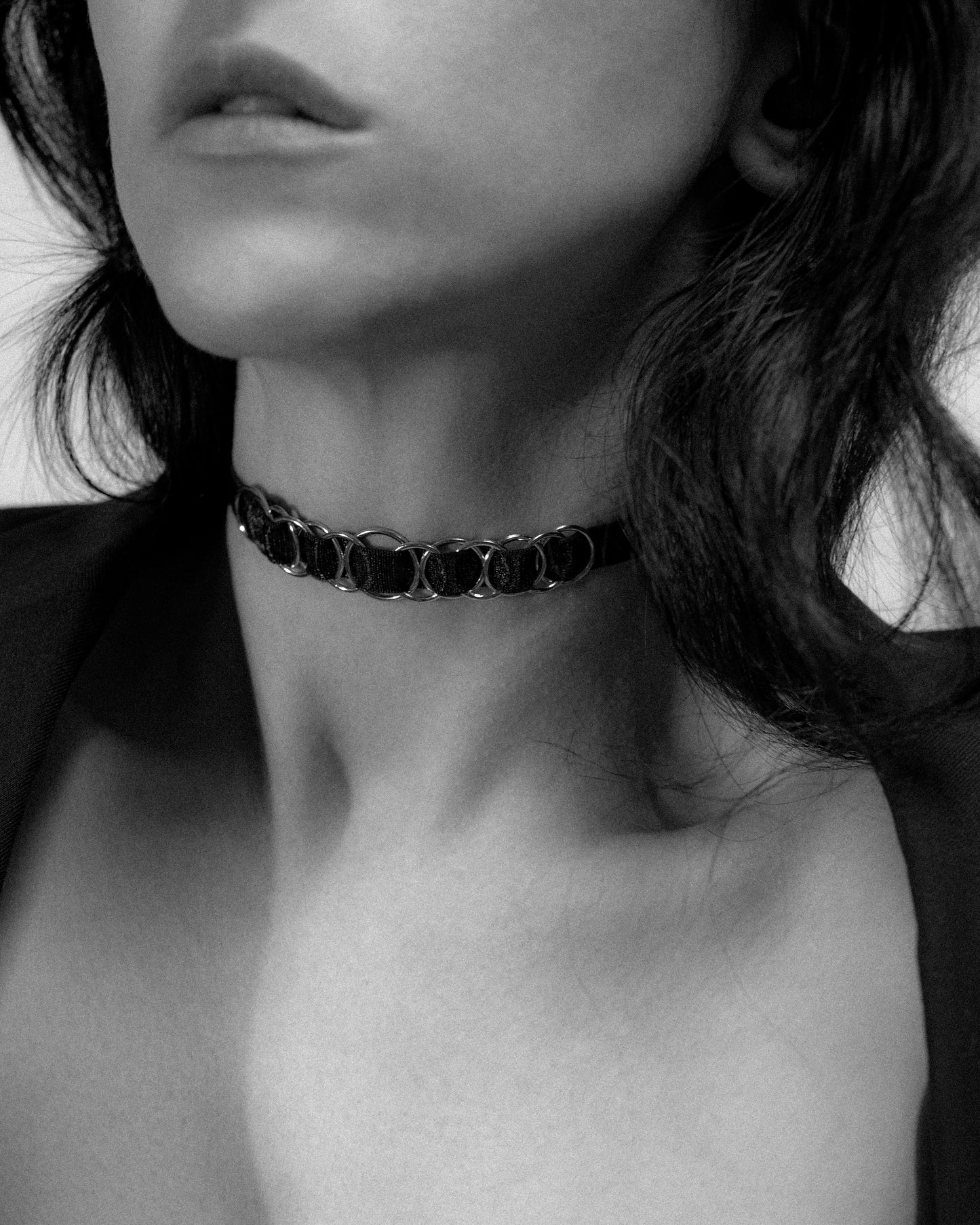 Black choker with woven gold o-rings 