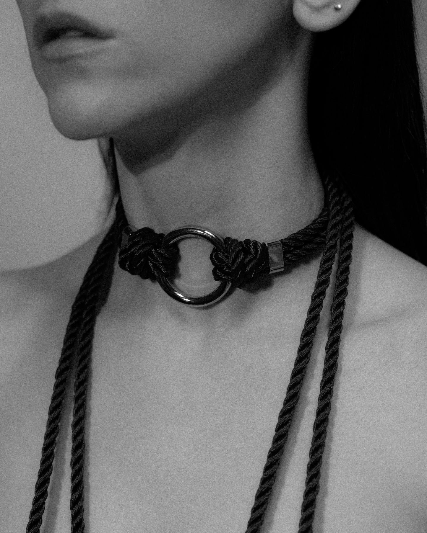 Black polyester rope design with central silver o-ring and self tie straps